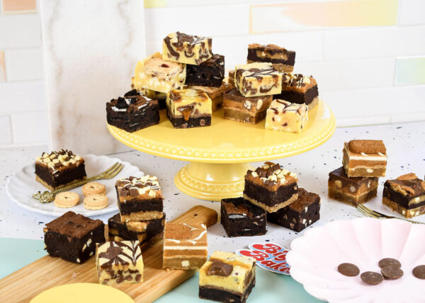 Selection of different flavoured brownies, blondies and other traybakes.